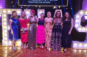 Sarah Turner wearing the 90-Day Wool Habit British wool dress styled for the EVAS with Handmade by Tinni Stella Necklace